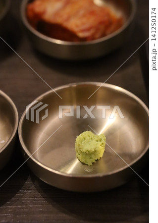 Green Food Morsel in Metal Bowl Green Food Morsel in Metal Bowl 141250174
