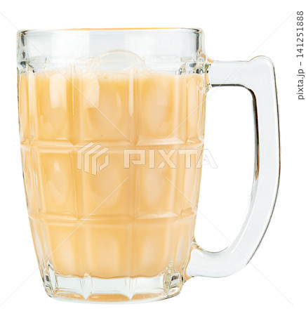 Large faceted glass mug filled with creamy milk tea or coffee with milk, isolated. Opaque beige beverage in a heavy tankard with handle, perfect for cafe or menu design. Large faceted glass mug filled with creamy milk tea or coffee with milk, isolated. Opaque beige beverage in a heavy tankard with handle, perfect for cafe or menu design. 141251888