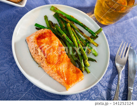 Grilled salmon filet with asparagus on plate Grilled salmon filet with asparagus on plate 141252124