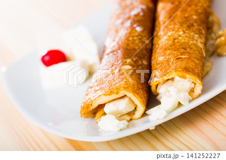 Pancakes with filling from brynza and walnuts, bulgarian dish palachinki Pancakes with filling from brynza and walnuts, bulgarian dish palachinki 141252227