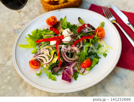 Fresh vegetable salad with mini mozzarella pearls Fresh vegetable salad with mini mozzarella pearls 141252699