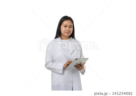 Young doctor with long hair using tablet, isolated on white, PNG 141254092