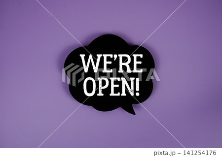 We're Open text with speech bubble on purple background We're Open text with speech bubble on purple background 141254176