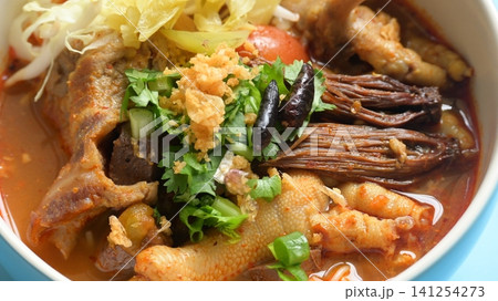rice vermicelli with northern thai curry sauce on blue background rice vermicelli with northern thai curry sauce on blue background 141254273