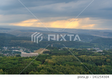 Layers of green mountains and hills in the haze during sunset. Panoramic View of Green hills and Meadow. Layers of green mountains and hills in the haze during sunset. Panoramic View of Green hills and Meadow. 141254304