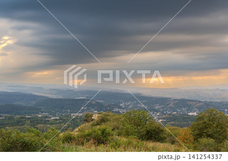 View of the mountains and Kislovodsk from the observation decks of the Kislovodsk Park. Evening sunset over the mountains of Kislovodsk. View of the mountains and Kislovodsk from the observation decks of the Kislovodsk Park. Evening sunset over the mountains of Kislovodsk. 141254337