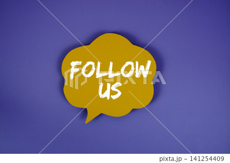 Follow Us text with speech bubble on purple background Follow Us text with speech bubble on purple background 141254409
