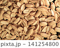 heap of roasted salted peanuts, showcasing their crunchy texture and natural golden color for snack packaging, food advertising, restaurant menus, recipe books, supermarket catalogs 141254800