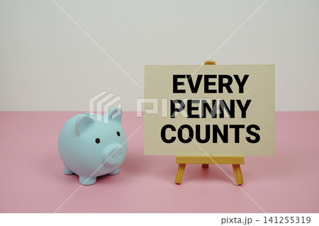 Every Penny Counts text written on paper card with easel and piggy bank Every Penny Counts text written on paper card with easel and piggy bank 141255319