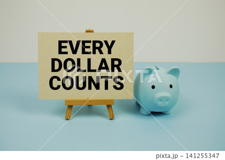 Every Dollar Counts text written on paper card with easel and piggy bank 141255347