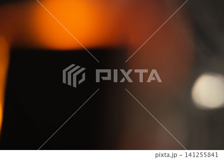 Soft bokeh glowing light effects with vibrant red, orange, and warm lens flare overlays Soft bokeh glowing light effects with vibrant red, orange, and warm lens flare overlays 141255841