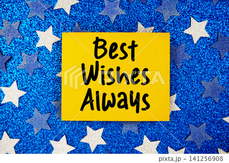 Best Wishes Always text written on paper card with star glitter on blue background Best Wishes Always text written on paper card with star glitter on blue background 141256908