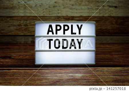 Lightbox with text "Apply Today" on wooden background Lightbox with text "Apply Today" on wooden background 141257018