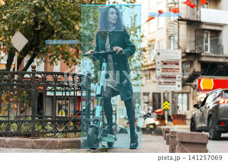 Surveillance system identifies user on electric scooter in urban area during daylight hours Surveillance system identifies user on electric scooter in urban area during daylight hours 141257069