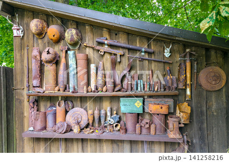 Collection of World War II Artifacts Recovered from Courland Pocket Battlefield Display on Wooden Wall 141258216