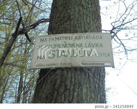 Memorial name sign made of metal hanging on a tree Memorial name sign made of metal hanging on a tree 141258845