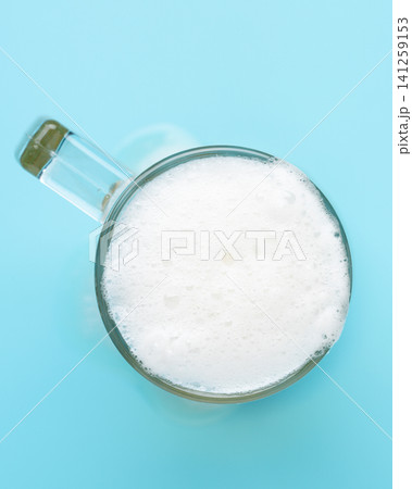Creamy beer foam mug blue vertical Creamy beer foam mug blue vertical 141259153