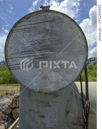 Close up view of a circular galvanized metal valve cover used in hydraulic water management for Bomba rice fields in Spain Close up view of a circular galvanized metal valve cover used in hydraulic water management for Bomba rice fields in Spain 141260465