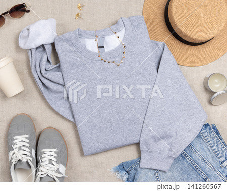 Blank sport grey unisex sweatshirt mockup, folded crewneck with copy space on front and sleeve 141260567