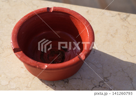 cigarette ashtray. are displayed on a grocery store shelf, showcasing colorful labels and various flavors in a well-organized arrangement 141260793