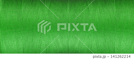 texture of thread for a sewing machine green color on a white background texture of thread for a sewing machine green color on a white background 141262214