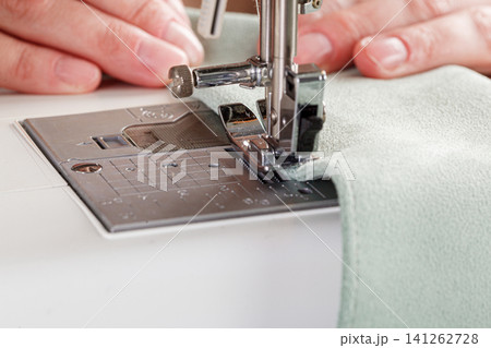 Sewing machine, stitching fabrics, needle in a round plan Sewing machine, stitching fabrics, needle in a round plan 141262728