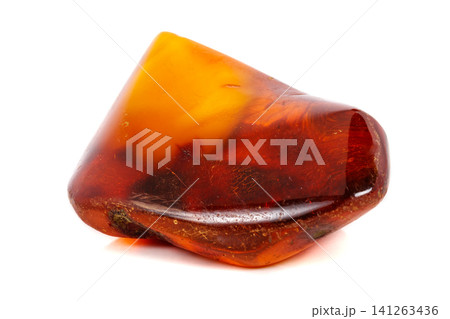 Macro Amber mineral stone on white background Macro Amber mineral stone on white background 141263436