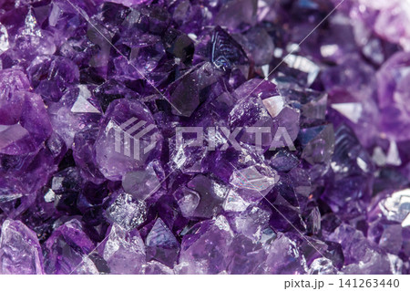 Amethyst Crystal Druse macro mineral on white background Amethyst Crystal Druse macro mineral on white background 141263440