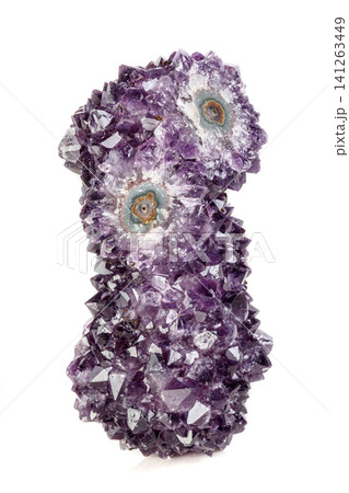 Macro mineral stone Amethyst eye, in the form of an owl on a white background Macro mineral stone Amethyst eye, in the form of an owl on a white background 141263449