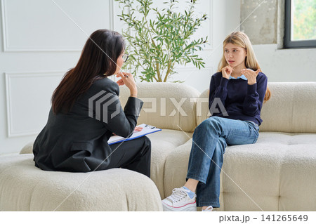 Social worker listening to a teenage student Social worker listening to a teenage student 141265649