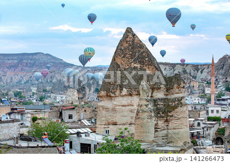 Hot air balloons float over Cappadocia in Turkey during early morning hours as the sun begins to rise.05.11.2018 Cappadocia Turkey Hot air balloons float over Cappadocia in Turkey during early morning hours as the sun begins to rise.05.11.2018 Cappadocia Turkey 141266473