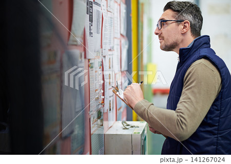 Man, business and board for checking schedule or calendar for shipping details, supplier information and warehouse. Guy, notice or clipboard and thinking for orders or inventory, poster and notes 141267024