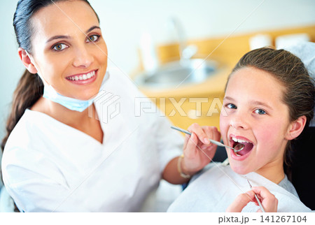 Tools, clinic and portrait of dentist and child for cleaning, teeth whitening and wellness. Health, dentistry and woman and girl with mirror and probe for dental hygiene, oral care or medical service Tools, clinic and portrait of dentist and child for cleaning, teeth whitening and wellness. Health, dentistry and woman and girl with mirror and probe for dental hygiene, oral care or medical service 141267104