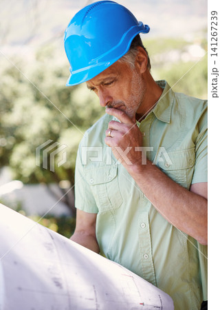 Contractor, blueprint and hard hat thinking of construction safety, house plans or building shelter. Man, floor layout or designer reflecting on project schematic, architecture or illustration Contractor, blueprint and hard hat thinking of construction safety, house plans or building shelter. Man, floor layout or designer reflecting on project schematic, architecture or illustration 141267239