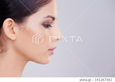 Woman, face and profile with beauty and skin, dermatology and mockup space with cosmetics on white background. Makeup, transformation and healthy glow for wellness, skincare and self care in studio 141267361