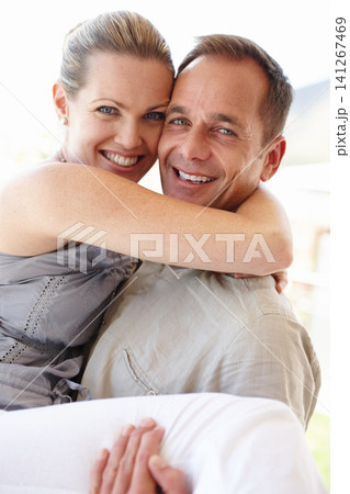Happy couple, portrait and carry with love, excited and bonding at home or holiday and vacation for honeymoon. Man and woman hugging together, support and smile with romance, care and happiness 141267469