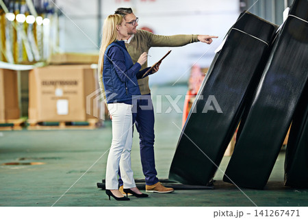 Business people, logistics and clipboard in warehouse for delivery, shipping inventory and stock inspection. Distribution, industrial factory and teamwork for freight, supply chain or quality control Business people, logistics and clipboard in warehouse for delivery, shipping inventory and stock inspection. Distribution, industrial factory and teamwork for freight, supply chain or quality control 141267471