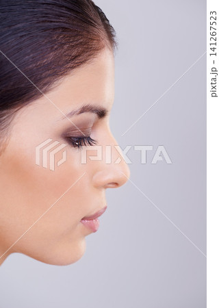 Woman, face and beauty for cosmetology, dermatology and skincare for hygiene and aesthetic in studio. Model, lady and isolated with makeup, eyeshadow and lipstick for full lips and eyelash on mockup 141267523