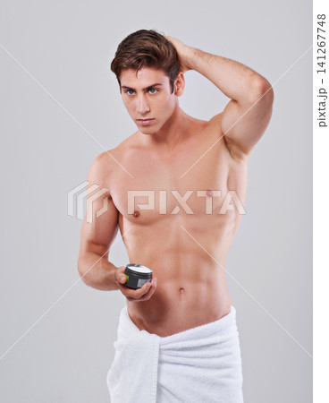 Hair care, cream and man on a white background for wellness, grooming and self care. Salon, health and isolated person with products, creme and cosmetics in studio for growth, texture and beauty Hair care, cream and man on a white background for wellness, grooming and self care. Salon, health and isolated person with products, creme and cosmetics in studio for growth, texture and beauty 141267748