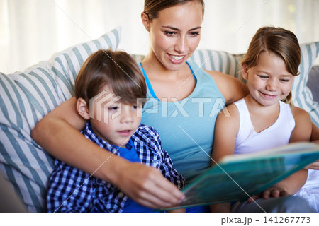 Mother, children and reading on sofa with book for fantasy story and learning for english literature or language skills for development. Family, relax and happy on couch in home with love and bonding Mother, children and reading on sofa with book for fantasy story and learning for english literature or language skills for development. Family, relax and happy on couch in home with love and bonding 141267773