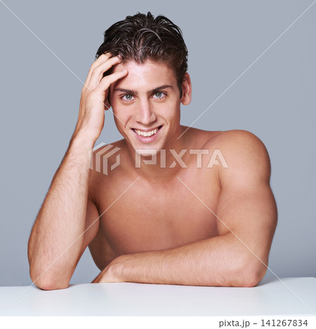 Man, portrait and smile for skincare confidence on grey background for wellness, dermatology or mockup space. Male person, facial and hand for healthy cosmetics with happiness, wellbeing or studio Man, portrait and smile for skincare confidence on grey background for wellness, dermatology or mockup space. Male person, facial and hand for healthy cosmetics with happiness, wellbeing or studio 141267834