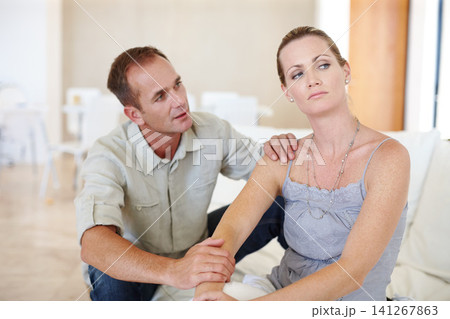 Divorce, couple or conversation in home for fight, conflict or ignore in living room. Sad woman, man or breakup with depression, anger or frustrated with stress in argument for marriage fail on sofa 141267863