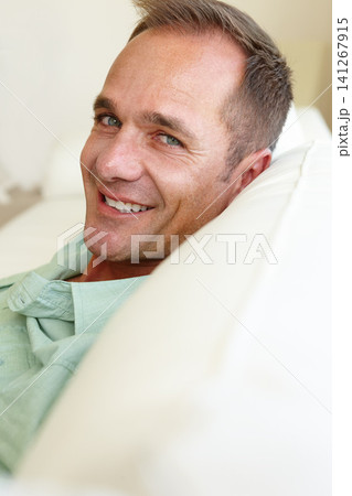 Portrait, guy or couch to relax at weekend in lazy, health or wellness as easy, self care or holiday. Tired, man or entrepreneur on sofa as happy, break or stress relief as rest and recreation Portrait, guy or couch to relax at weekend in lazy, health or wellness as easy, self care or holiday. Tired, man or entrepreneur on sofa as happy, break or stress relief as rest and recreation 141267915