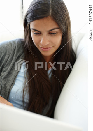Woman, home and laptop on sofa, happy female person and comfortable on internet to browse for streaming movies online. Research, web on technology for elearning or education with social media Woman, home and laptop on sofa, happy female person and comfortable on internet to browse for streaming movies online. Research, web on technology for elearning or education with social media 141267943