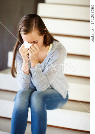 Stress, crying or woman in house with tissue, depression or mental health, crisis or disaster. Stairs, vertigo or sad person with tears, anxiety or overwhelmed fail, mistake or ptsd, memory or trauma Stress, crying or woman in house with tissue, depression or mental health, crisis or disaster. Stairs, vertigo or sad person with tears, anxiety or overwhelmed fail, mistake or ptsd, memory or trauma 141268569