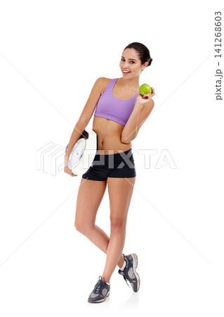 Portrait, scale and woman with benefits, apple and healthy person isolated on a white studio background. Face, girl and model with wellness and nutrition with diet plan and weight loss with fitness 141268603