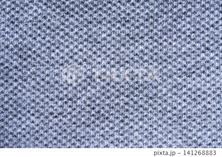 The texture of a  grey knitted fabric. 141268883