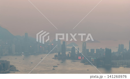 July 11 2026. Hong Kong Victoria Harbour Skyline Through Evening Haze July 11 2026. Hong Kong Victoria Harbour Skyline Through Evening Haze 141268976