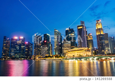 Beautiful Singapore cityscape at dusk, iconic Marina Bay landmarks at night. Beautiful Singapore cityscape at dusk, iconic Marina Bay landmarks at night. 141269388