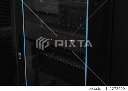 Glass-doored server rack housing rack servers and cabling Glass-doored server rack housing rack servers and cabling 141272600